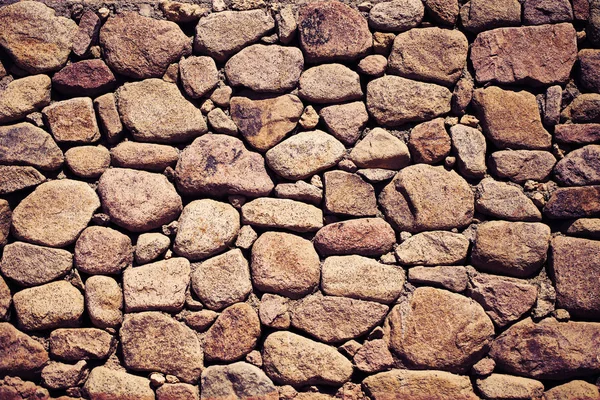 Oude stenen verharde muur, getextureerde achtergrond — Stockfoto