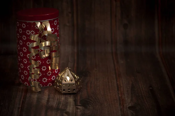 christmas golden decorations, red patterned tin with golden line