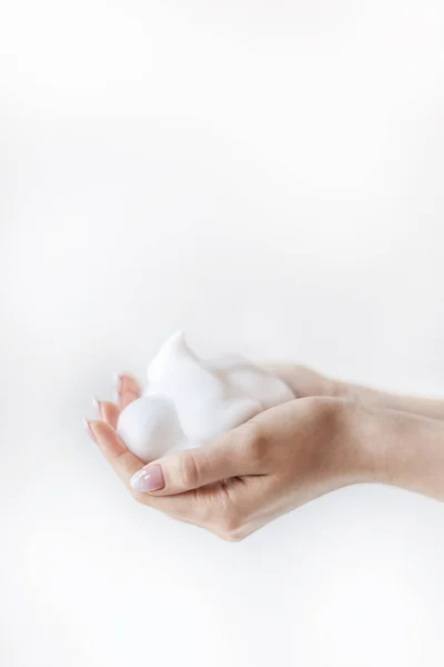 Women Hands Filled White Soft Foam — стоковое фото