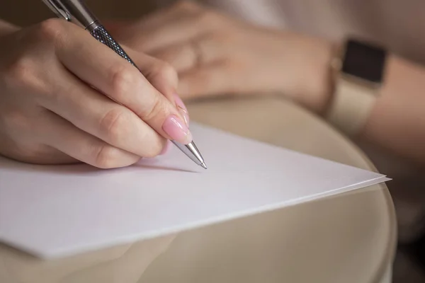 Girl Writes Black Pencil White Sheet Paper Beautiful Manicure Work — Stock Photo, Image