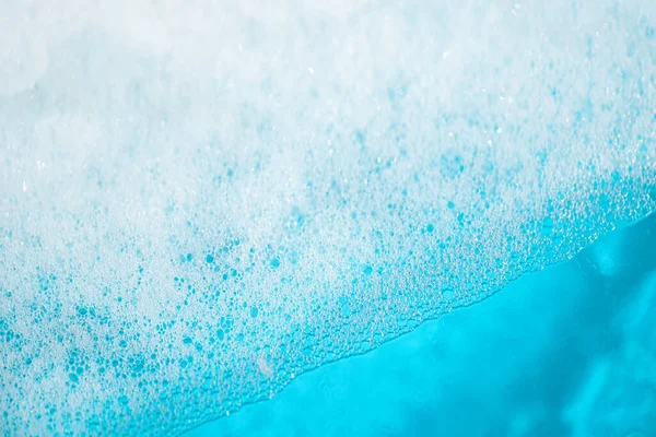 soap foam on the water, detergent bubbles. Abstract background of soap foam