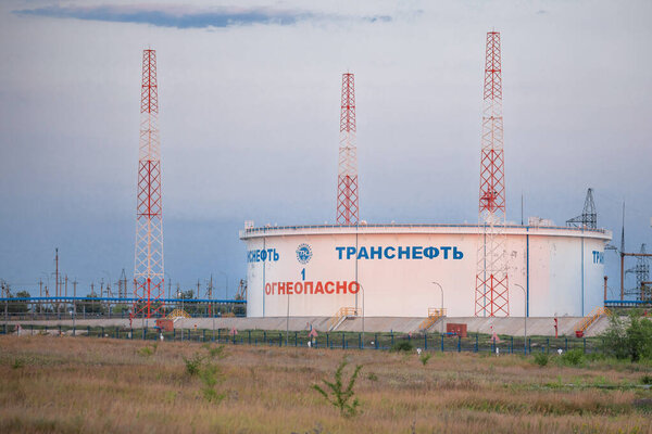 terminal for storage and transportation of oil of the company "Transneft", company logo and inscription FIRE DANGEROUS on the tank,  August 05, 2020 Russia, Volgograd region