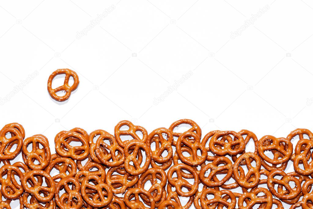 bretzels with salt on a white plate, beer snack, traditional Bavarian snack, isolate