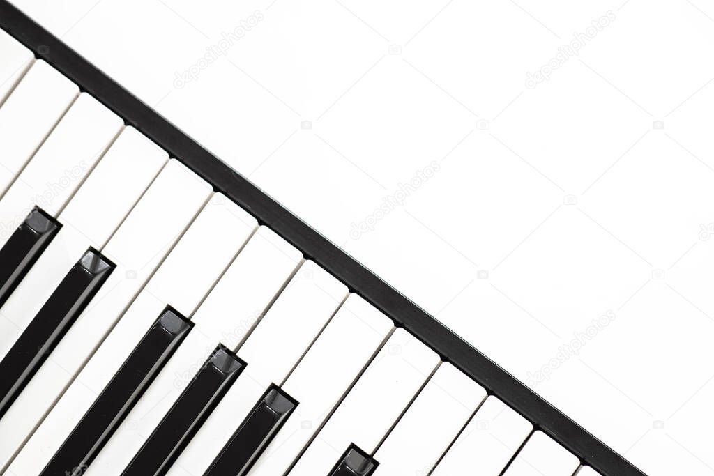 black and white piano or synthesizer keys isolated on white background, concept of music, 