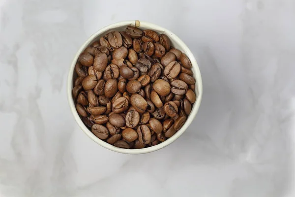 Coffee Beans Paper Cup Marble Surface Top View Copy Space — Stock Photo, Image