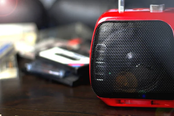 Red audio radio with balck speaker closeup retro vintage 90\'s style