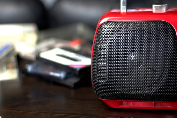 Red audio radio with balck speaker closeup retro vintage 90's style