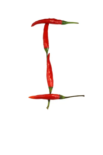 Alphabet of hot spice cayenne chili peppers isolated on white. Natural vegetarian diet organic vegetable chili peppers in shape of letter I, for making words and using as a logo