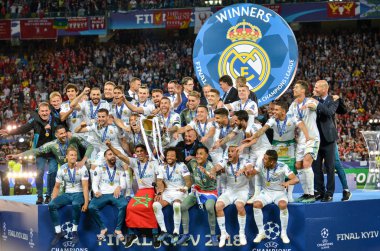 KYIV, UKRAINE - MAY 26, 2018: Footballers of Real Madrid celebrate the victory in the final of the UEFA Champions League 2018 in Kiev  match between Real Madrid and Liverpool, Ukraine clipart