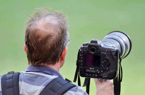 Madrid, Španělsko-01 květen 2019: fotograf s kameramským výhonem — Stock fotografie