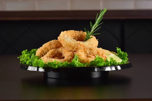 Deep fried tempura squid rings and salad