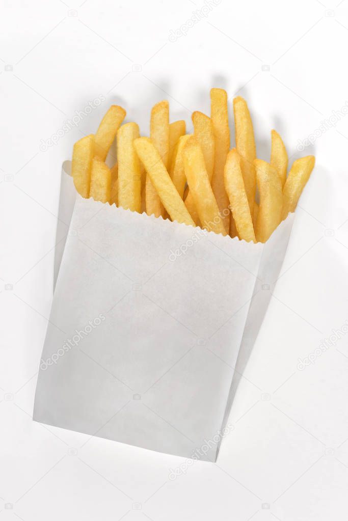 French fries on white paper bag