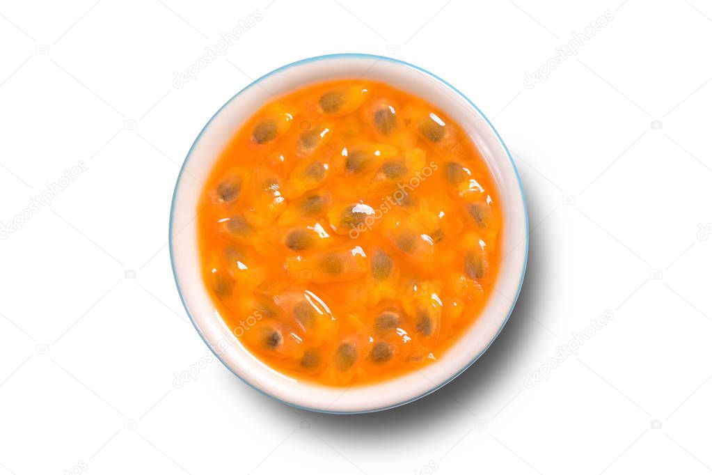 Passion fruit pulp bowl isolated on white