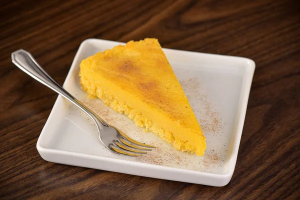 Corn cake slice on squared plate