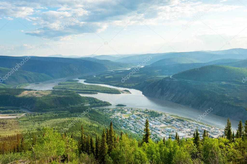 Panoramic view of Dawson city and Yukon river from the top of Midnight Dome mountain, Yukon territory, Canada