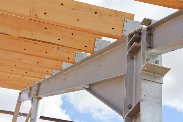 Metal frame new cowshed on the farm. The construction phase of the building. Construction of a metal frame for further insulation.