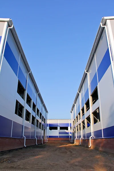 New buildings of sandwich panels on the construction site. Sandwich panel as a universal material for the construction of buildings. The fast-built designs.