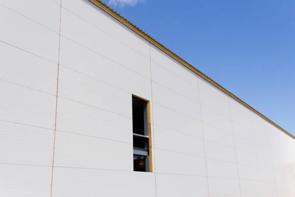 Sandwich panels on the metal frame. Material for warming the walls during construction. Technologies in construction. An alternative to a brick building.