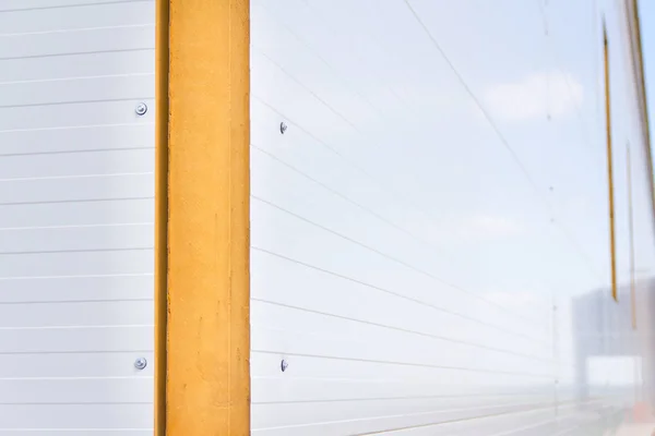 Sandwich panels on the metal frame. Material for warming the walls during construction. Technologies in construction. An alternative to a brick building.