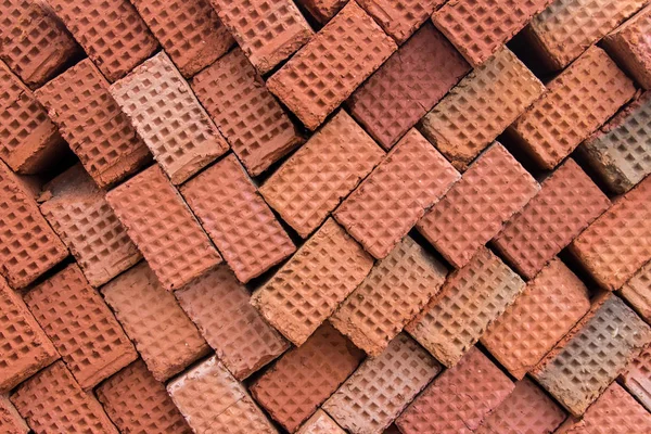 New red clay bricks for masonry building walls. Material for the construction of a new building.