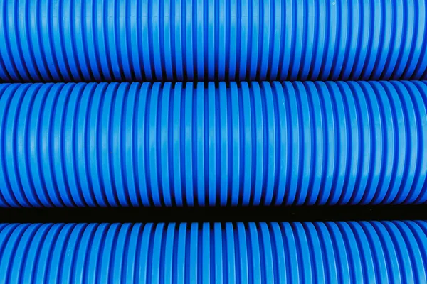 Blue plastic pipes used in the water supply system. Materials in the construction of buildings