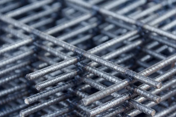 Steel mesh for construction Steel Rebars for reinforced concrete. Steel reinforcement bar texture in construction site.