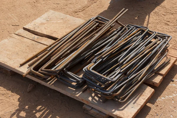 Metal rods. Preparatory work before concreting. Rebars for reinforced concrete. Steel reinforcement bar texture in construction site.