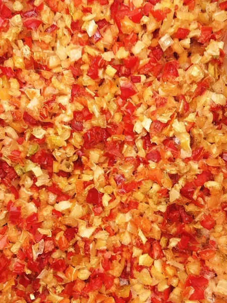 Red-yellow-orange mix of chopped paprika. View from above