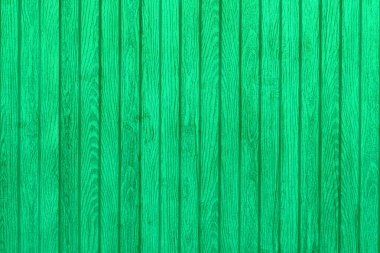 Dikey ahşap kaburgalar yeşil dokulu arka plan. Ön görünüm.