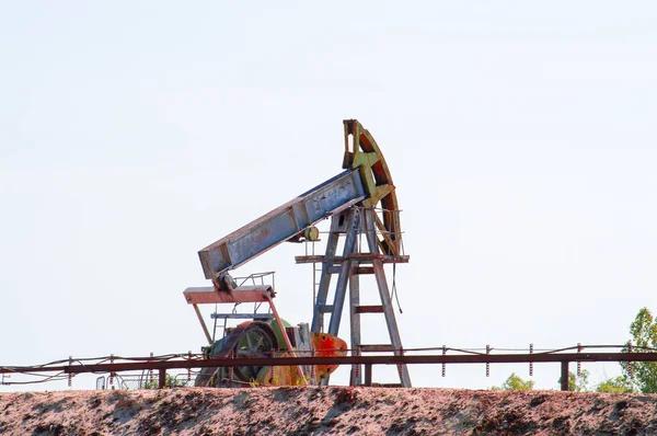 Oil rocking pump. At a field in Siberia. Front view.