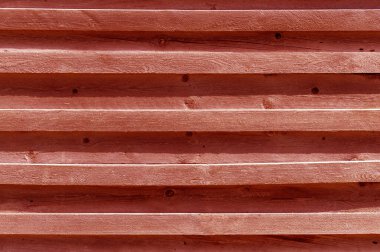 Yatay kahverengi tahta ve kalaslar, duvarın bir parçası. Desenli arkaplan.