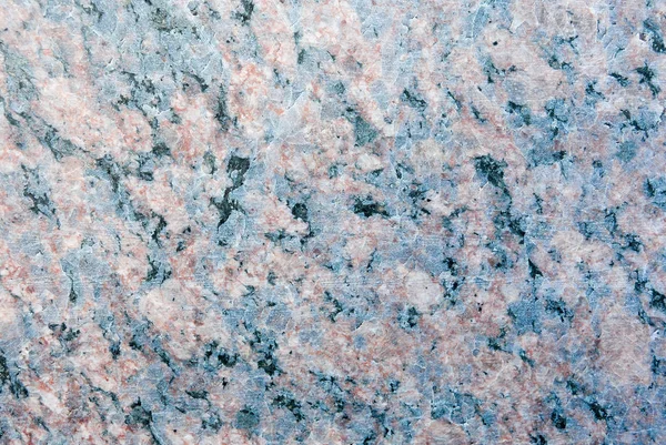 The texture of polished granite stone with a beautiful pattern.