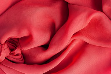 Kırmızı ipek kumaş kırmızı renk dokusal arka plan.
