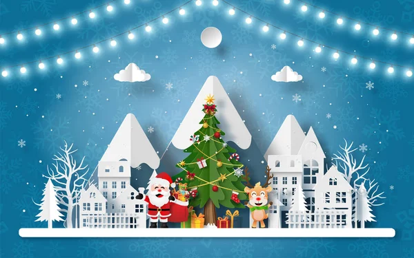 Mutlu Noeller ve mutlu yıllar, Noel Baba 'nın kağıt sanatı ve kar dağının oradaki köyde ren geyiği