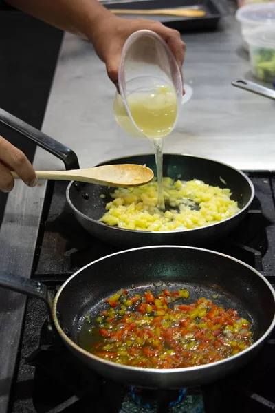 Freshly Chopped Organic Vine Ripened Tomatoes Being Dropped Into A Hot Frying Pan As Part Of A Recipe Stage 148388923 Larastock<script async src=