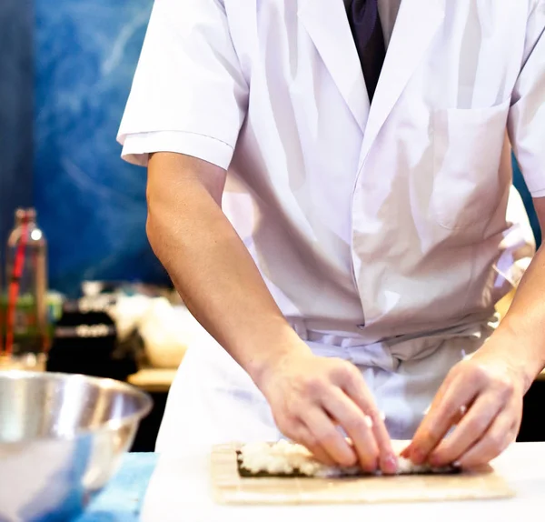 chef hands preparing japanese food, chef making sushi, Preparing Sushi roll