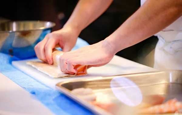 chef hands preparing japanese food, chef making sushi, Preparing Sushi roll