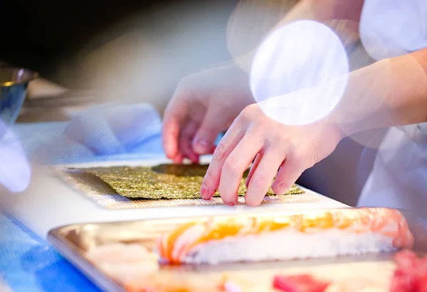 chef hands preparing japanese food, chef making sushi, Preparing Sushi roll