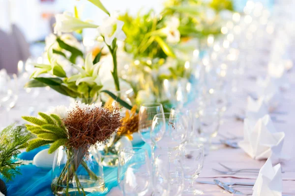 Dining table, Wedding table that decorated with flower arrangements and candles