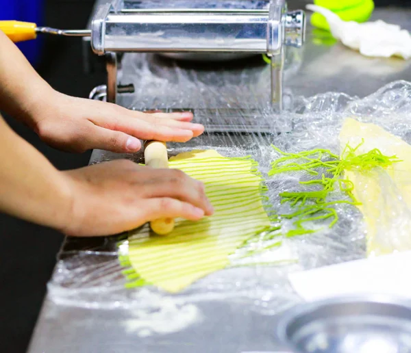 Chef Making Fresh Homemade Pasta, cooking Italian pasta, or noodles