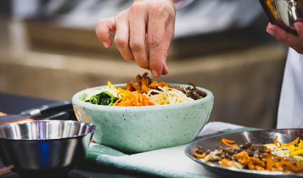 Bibimbap, Traditional Korean cuisine bibimbap, Chef preparing Korean food, chef cooking in kitchen