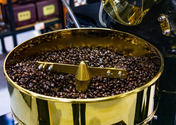 Roasted coffee in coffee roaster, arabica roasted coffee crop