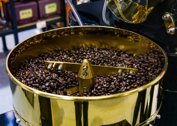 Roasted coffee in coffee roaster, arabica roasted coffee crop