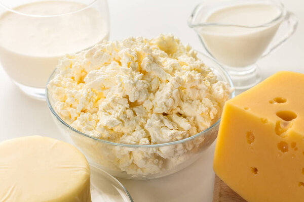 still life of dairy products on white background