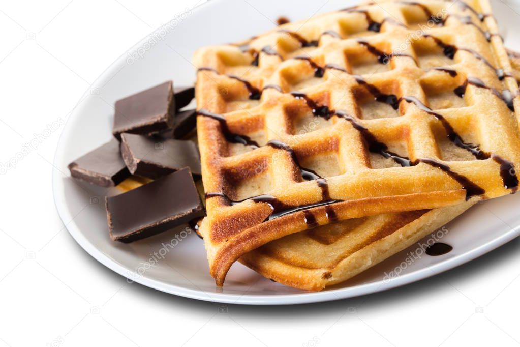 Belgian waffles with chocolate on white isolated background