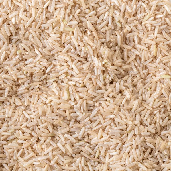 food background, texture unpolished rice brown close-up