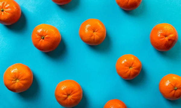 food background, tangerines on blue