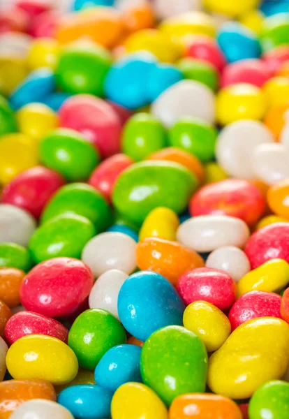 food background of round candy in multicolored glaze