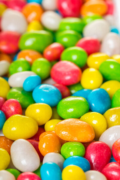 food background of round candy in multicolored glaze