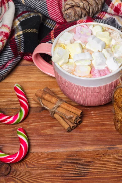 Holiday cup of cocoa with marshmallow or coffee with spice and home cookies. Christmas background.